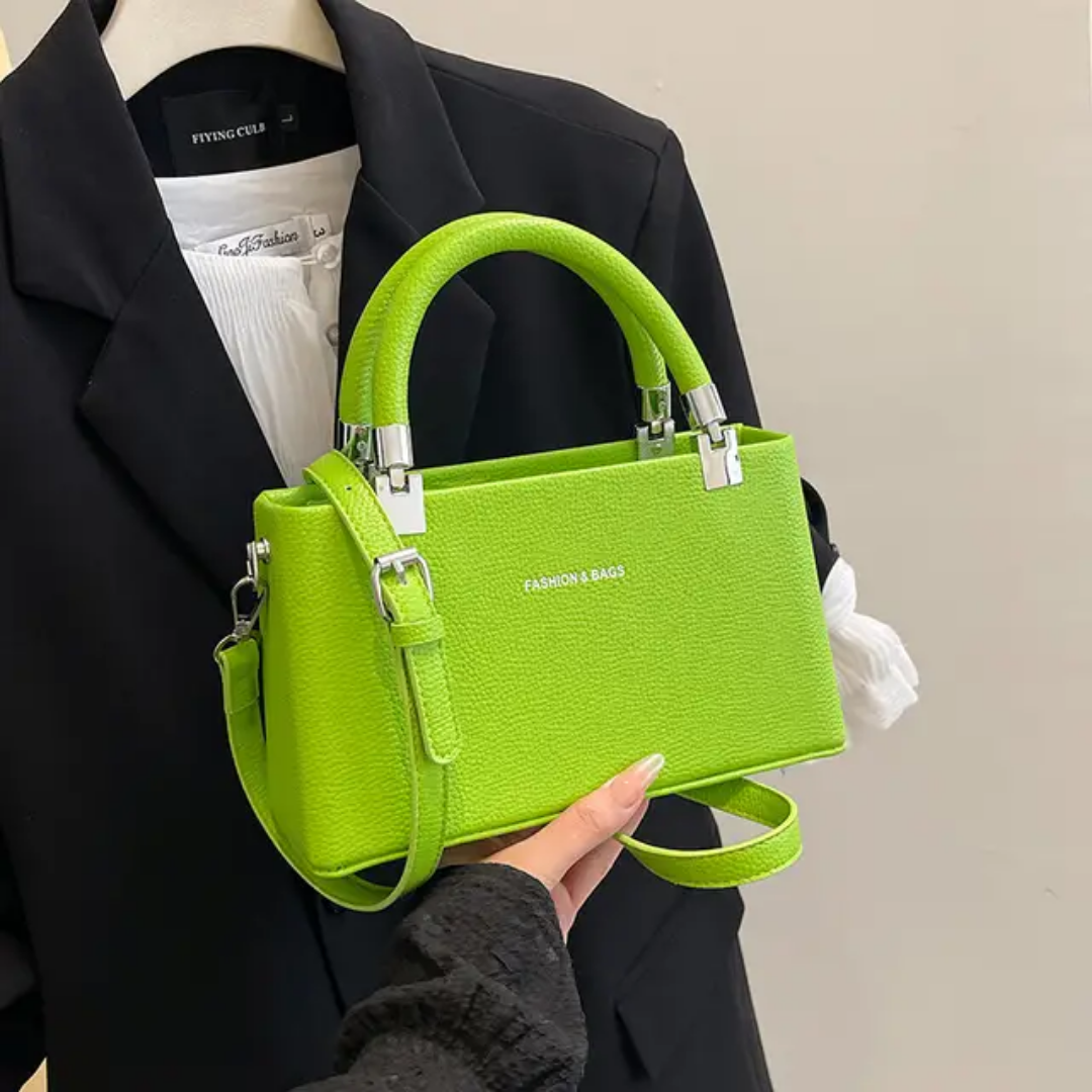 Small faux leather top-handle bags with a crossbody strap option. 