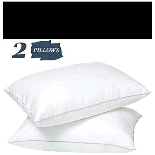 A pair of large fibre pillows- white