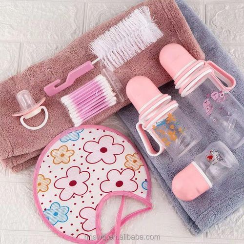 A Set Of Three Baby Bottles With Helpers - Pink