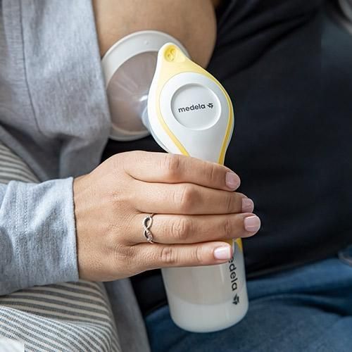 Medela Manual Breast Pump, Single Hand Breastpump with Flex Breast Shields for More Comfort and Expressing More Milk-Yellow