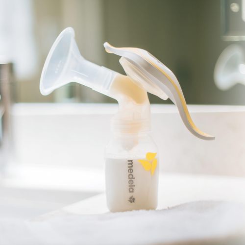 Medela Manual Breast Pump, Single Hand Breastpump with Flex Breast Shields for More Comfort and Expressing More Milk-Yellow